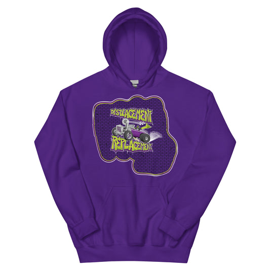 Purple hoodie with green and purple illustration of a retro coupe with a small engine and a giant turbo charger spinning it's wheels in front of a brick wall with a crash test dummy driving and graffiti styled text that reads Displacement Replacement.