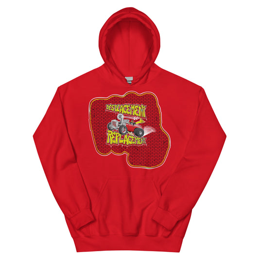Red hoodie with red and yellow illustration of a retro coupe with a small engine and a giant turbo charger spinning it's wheels in front of a brick wall with a crash test dummy driving and graffiti styled text that reads Displacement Replacement.